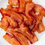 closeup image of a plate of crispy air fryer bacon