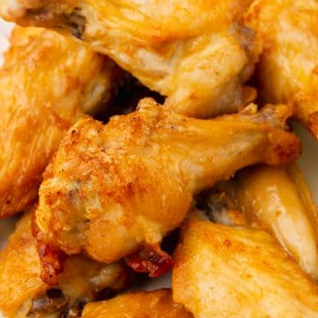 closeup shot of a pile of crispy air fryer chicken wings
