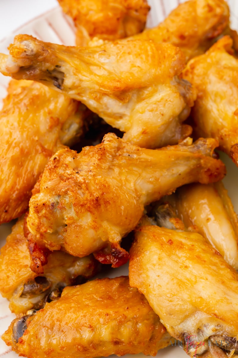 closeup shot of a pile of crispy air fryer chicken wings