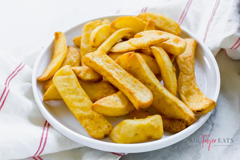 Close up for air fryer steak fries on a white plate