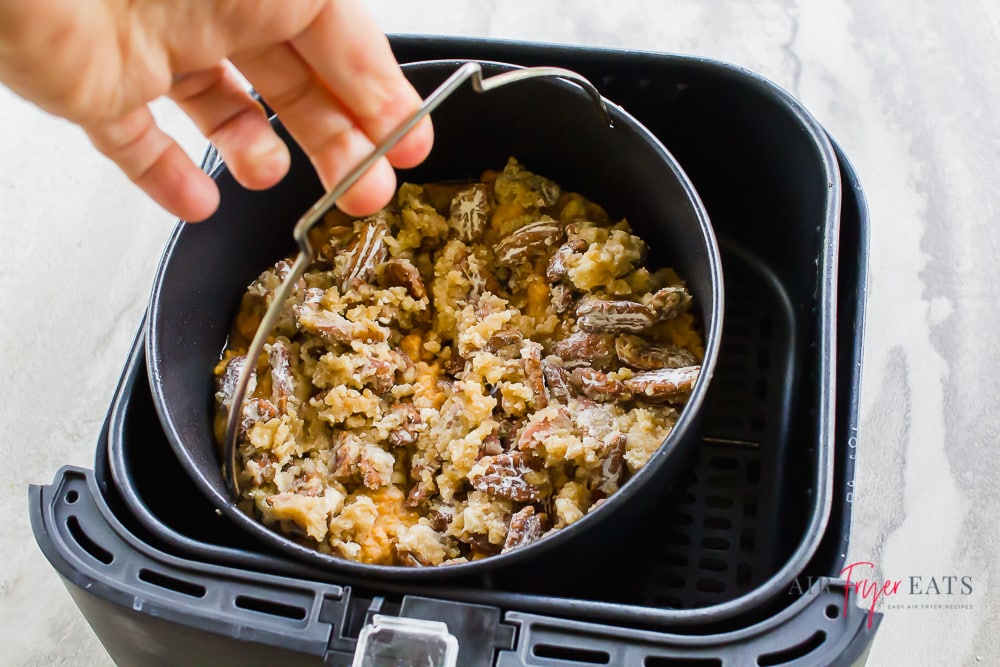 Picture of air fryer sweet potato casserole inside of a black air fryer basket