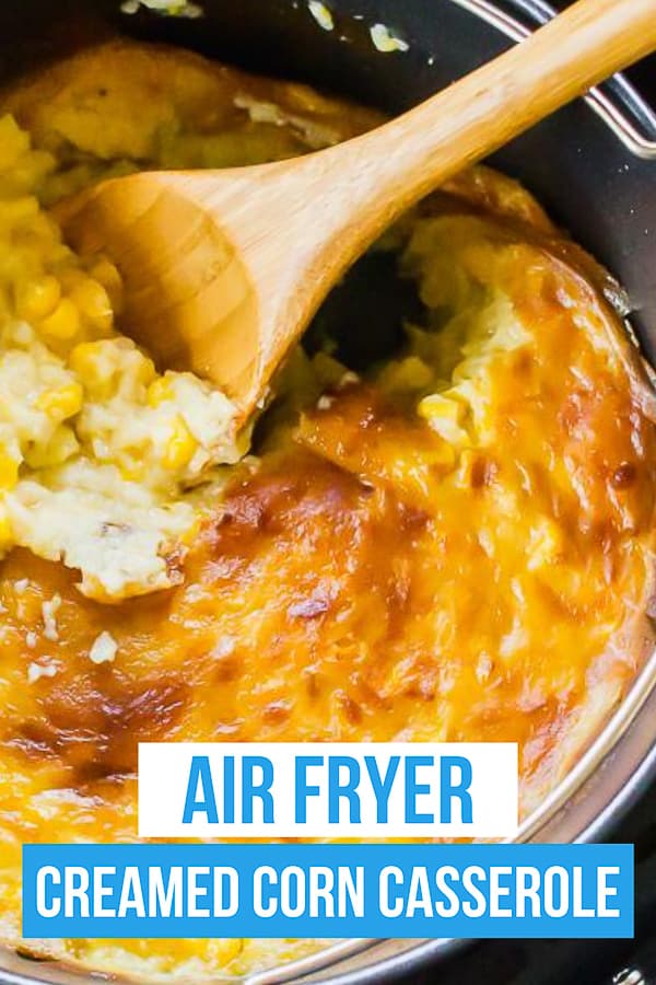 air fryer creamed corn casserole upclose shot with wooden spoon and title text overlay