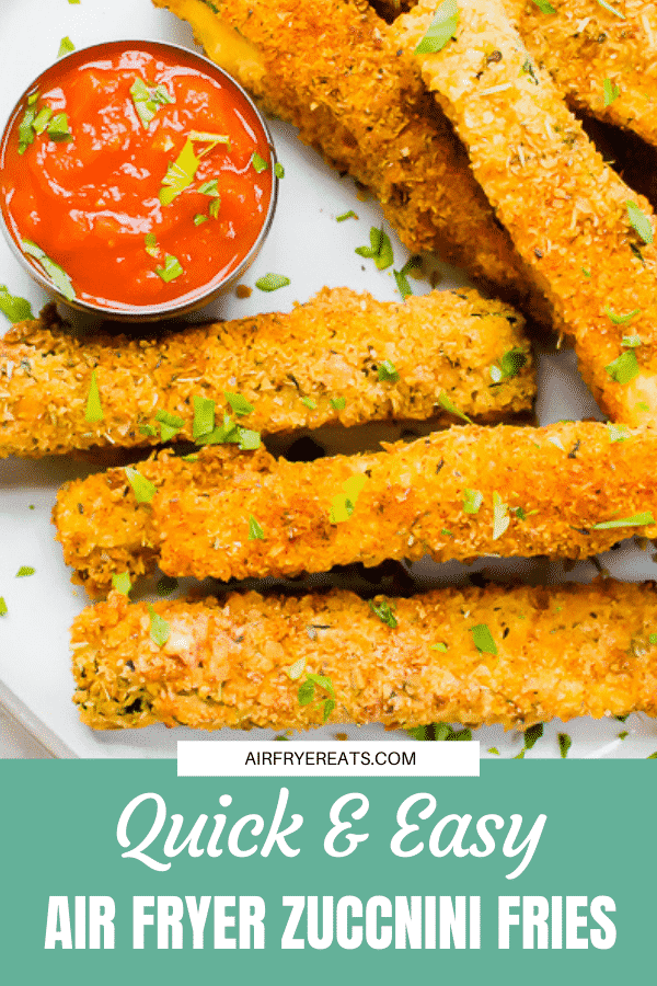zucchini fries garnished with parsley and served with a side of marinara