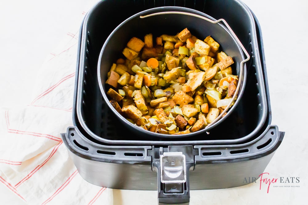 air fryer stuffing in a pot inside a black air fryer basket