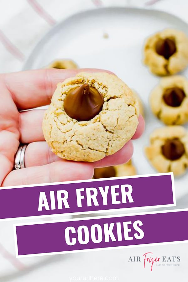 Air Fryer Peanut Butter Blossom Cookies are a delicious traditional cookie that is perfect for a holiday or for any time of year. Make these cookies in the air fryer in 7 minutes! #airfryer #peanutbuttercookies #christmascookies via @vegetarianmamma