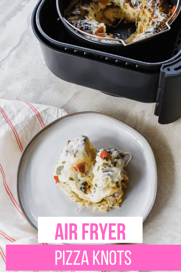 For a fun twist on pizza, try making Air Fryer Garlic Knot Pizza. Refrigerated biscuits are stuffed with pizza toppings and baked together with extra cheese for a kid friendly, crowd pleasing dish. #airfryerpiza via @vegetarianmamma