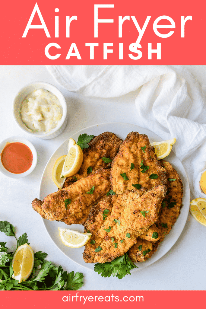 Overhead shot of a plate of catfish filets garnished with lemon wedges and parsley with overlay text