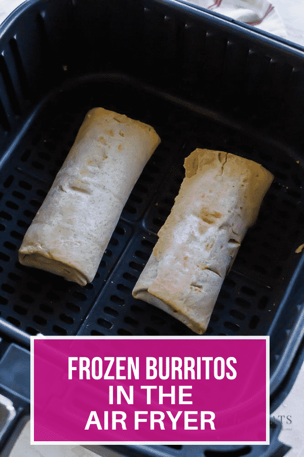 two frozen burritos in a square air fryer basket