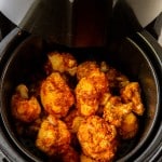 Buffalo Cauliflower in an air fryer basket