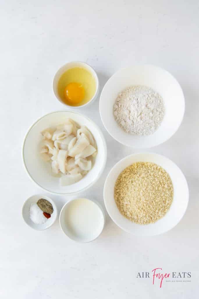 ingredients for air fryer calamari each in separate bowls