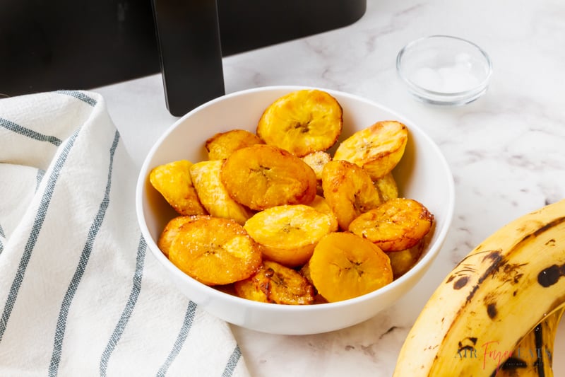 horizontal image of a bowl of air fryer plantains