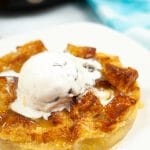 a round bread pudding topped with vanilla ice cream