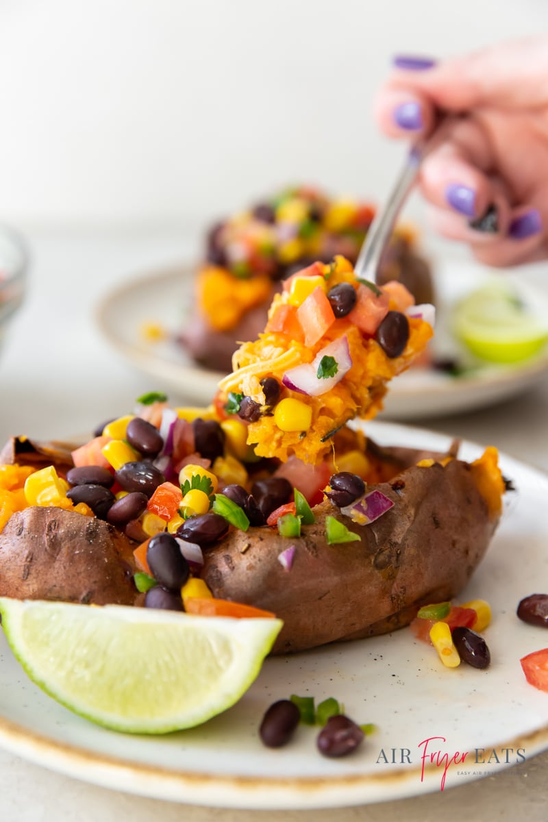 eating a mexican sweet potato with a fork