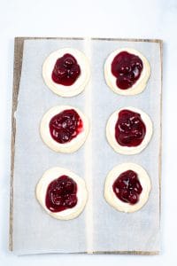 Cresent rounds topped with cream cheese and cherry pie filling