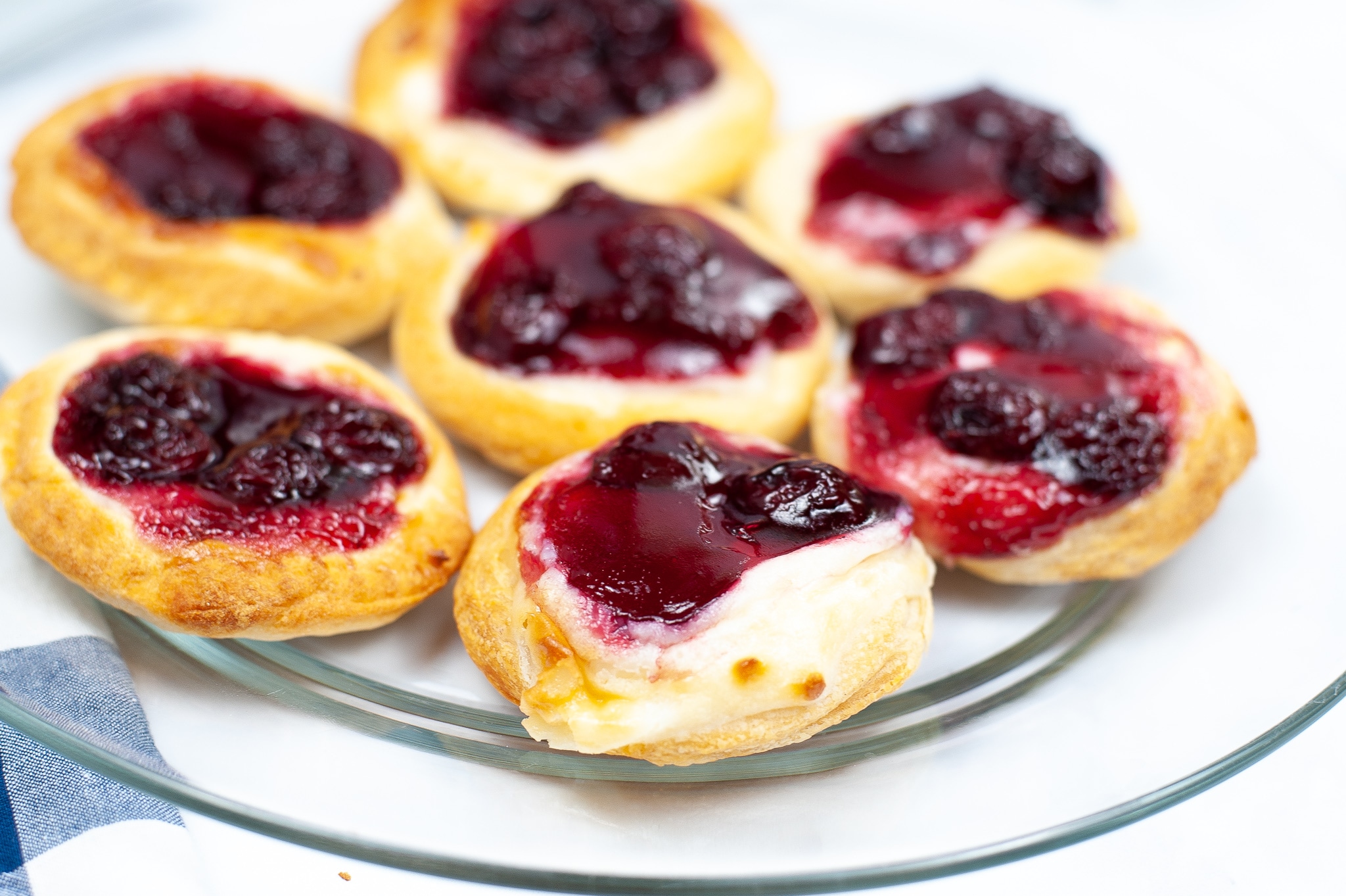 a plate filled with cherry cream cheese danish