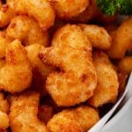 closeup view of popcorn shrimp cooked in an air fryer