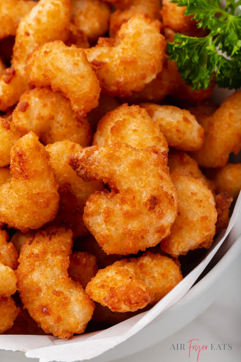 closeup view of popcorn shrimp cooked in an air fryer