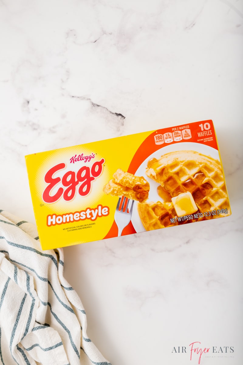 A box of eggo frozen waffles on a marble counter