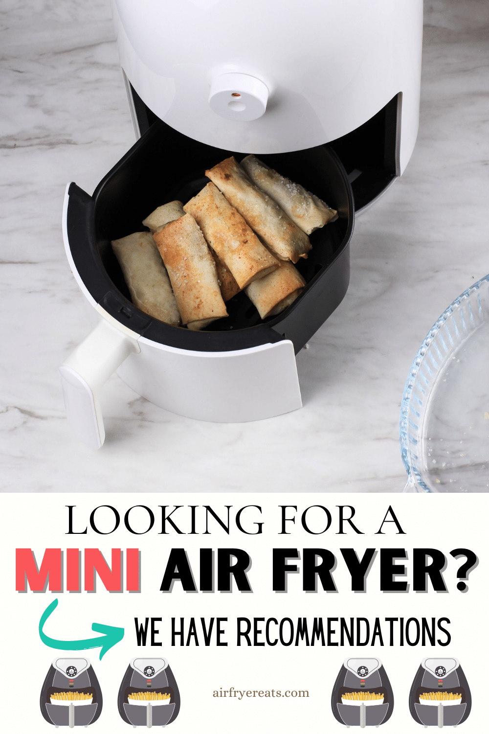 white counter with white air fryer with basket slightly pulled out with cooked egg rolls. text: looking for a mini air fryer