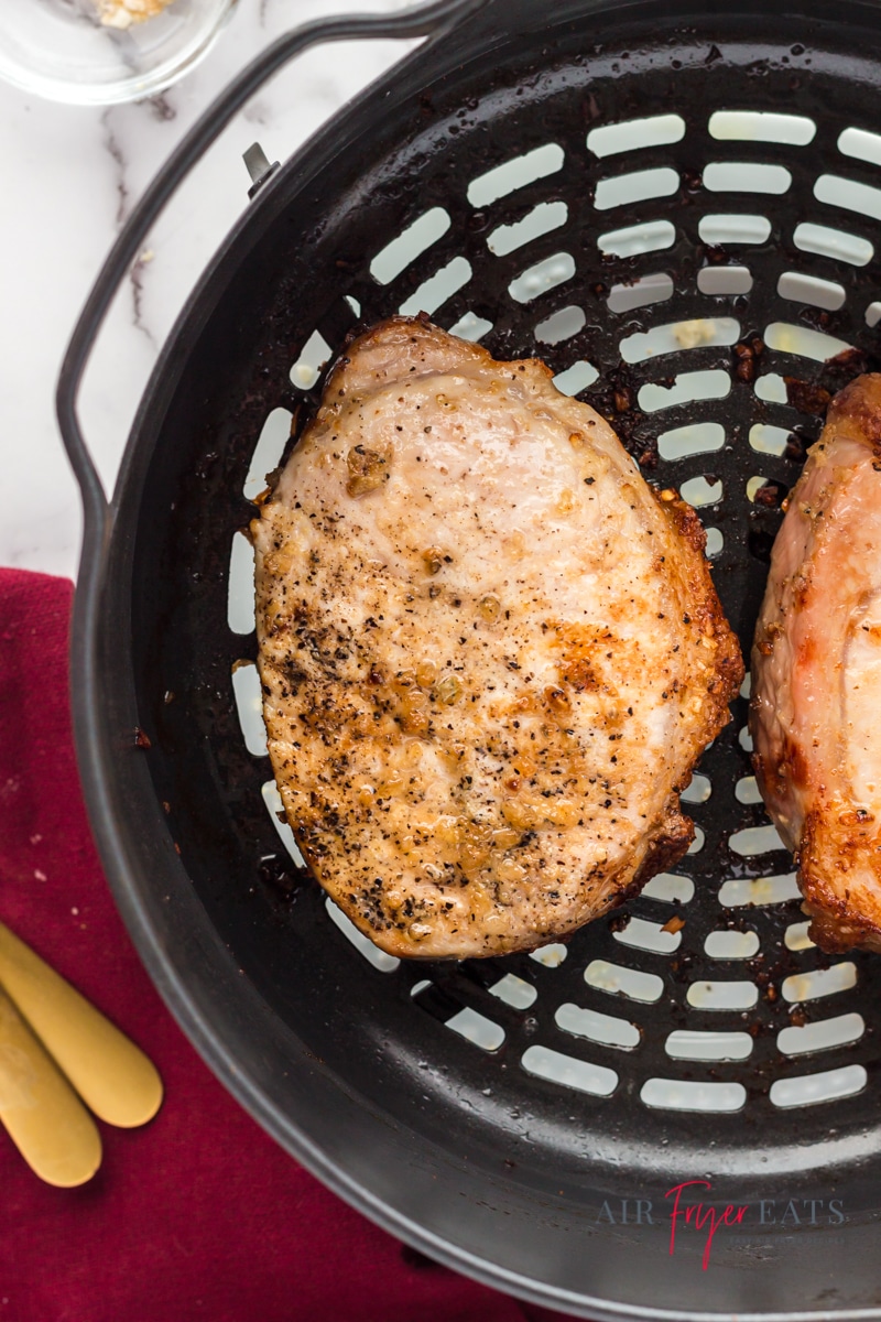 cooked porkchops in the basket of a ninja foodi