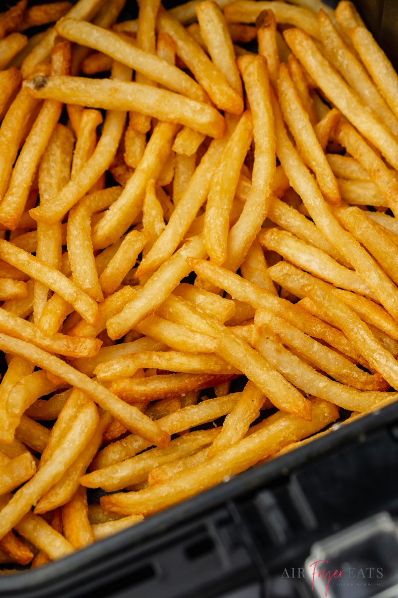 closeup view of a basket of reheated air fryer french fries