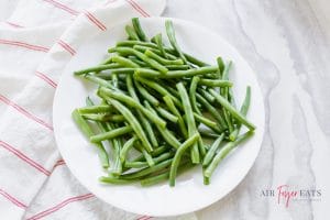 white bowl of green beans