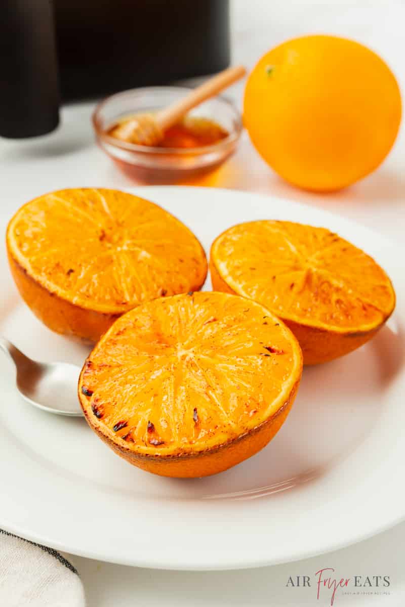 a plate of air fried oranges that are lightly browned. 