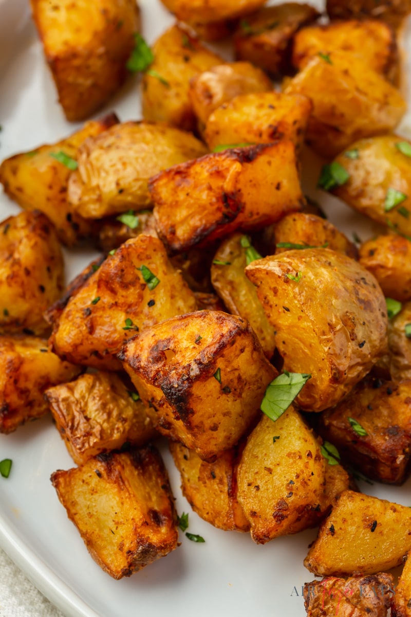 air fryer home fries on a plate, closeup view.