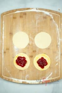 Dough discs filled with strawberry preserve