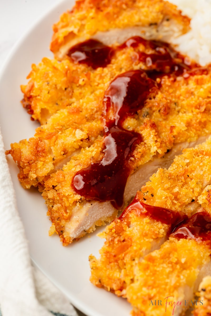 crispy air fryer chicken katsu, sliced and drizzled with japanese bbq tonkatsu sauce. 