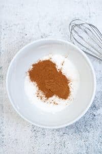 Butter, white sugar cinnamon, eggand brown sugar in a bowl