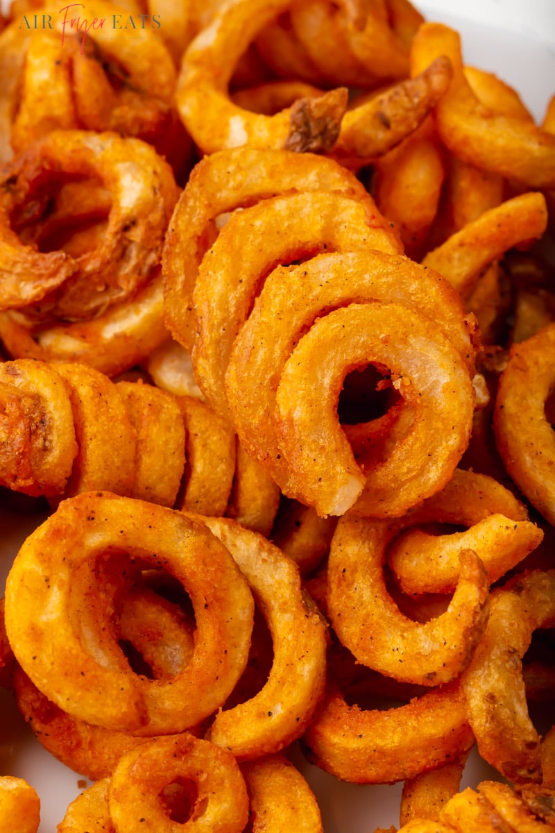closeup view of curly fries cooked in the air fryer.