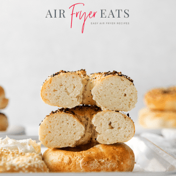 Photo of air fryer bagels, stacked on top of each other and two sliced in half so you can see the fluffy crumb texture.