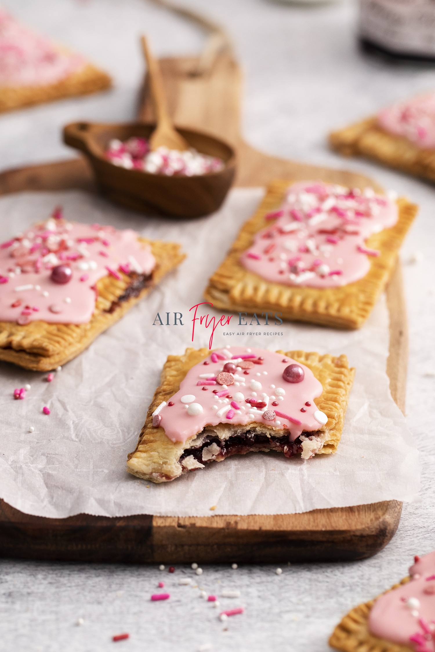 homemade air fried pop tarts with cherry jam filling and pink frosting