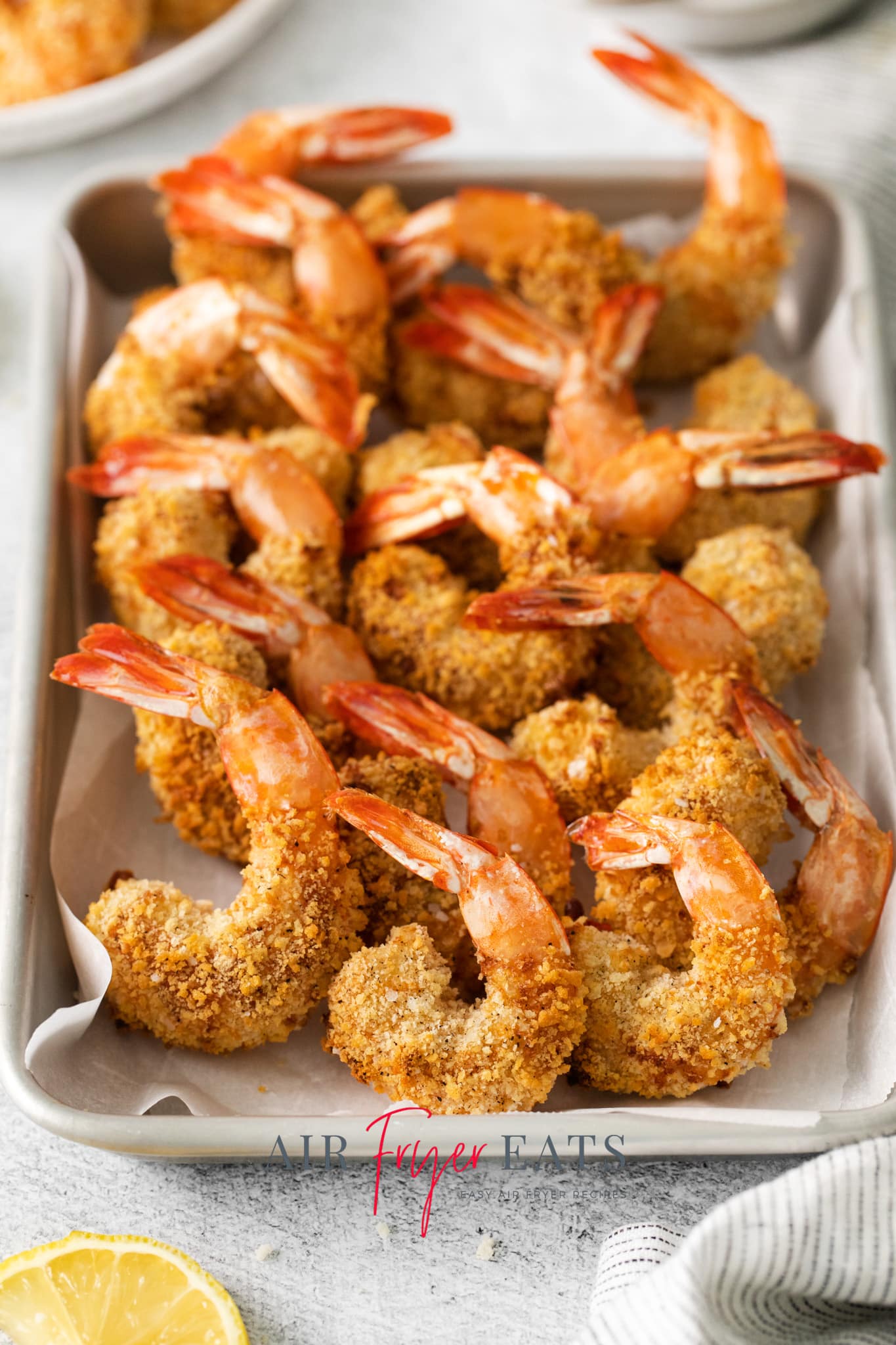 a platter of large breaded air fried shrimp.