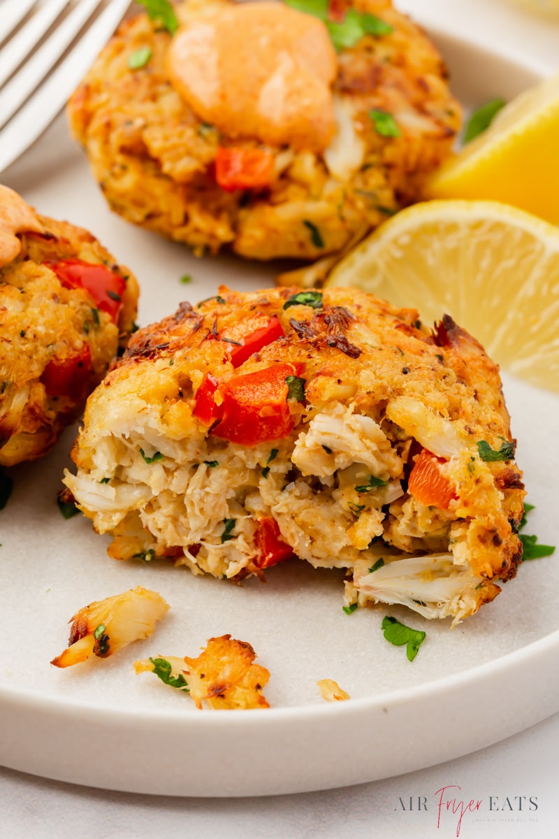 an air fryer crab cake, cut in half to show the flaky interior