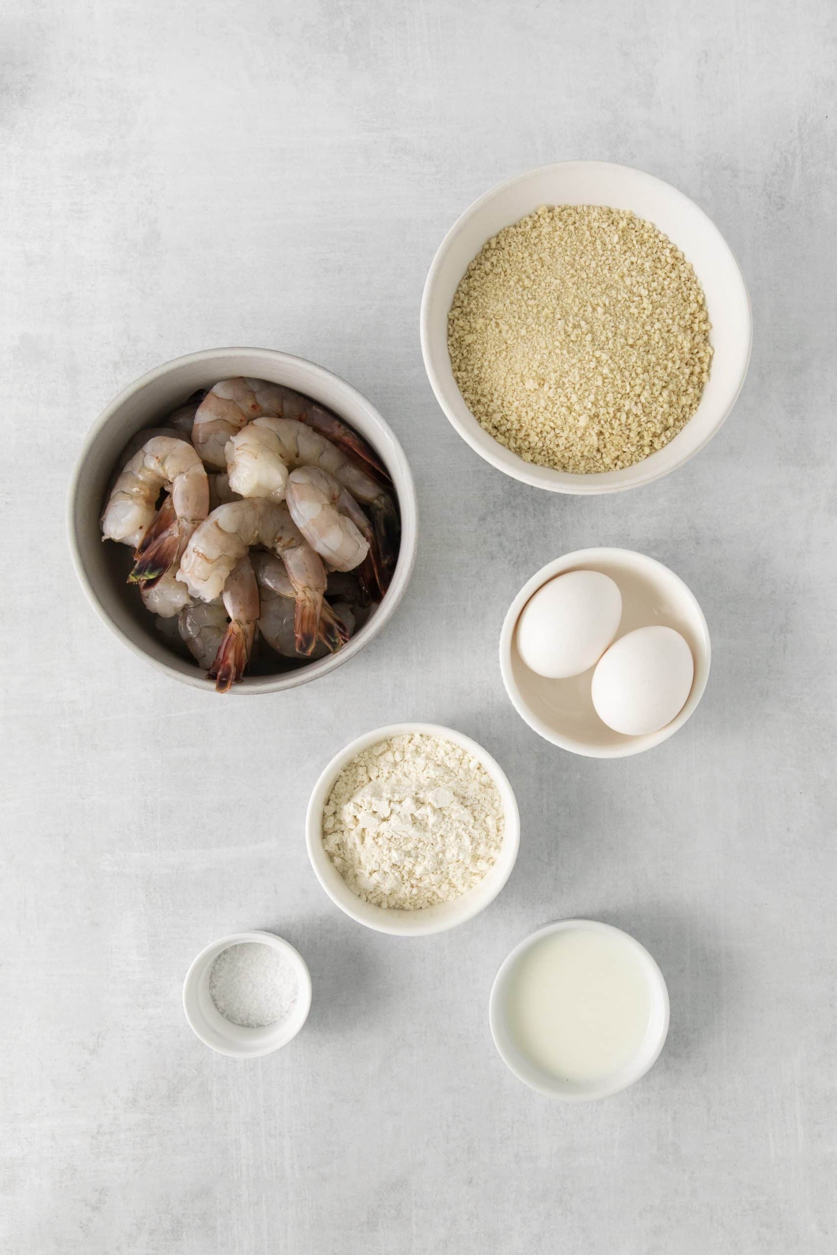 The ingredients needed to make air fryer breaded shrimp.