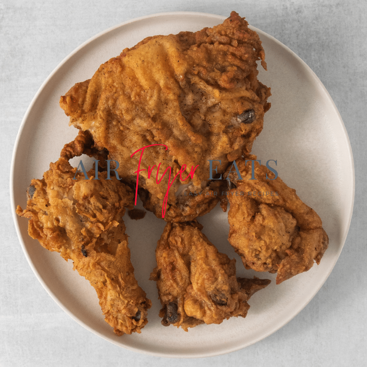 a round plate of leftover fried chicken.